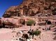 Jordan: Arab horsemen in front of The Urn Tomb, Petra